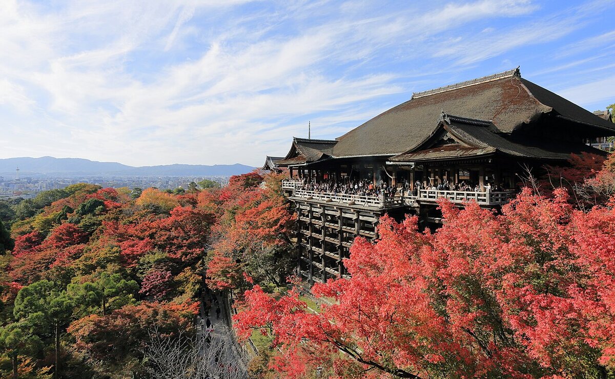 Kiyomizu-dera temple in Kyoto with autumn leaves, a top city in luxury travel trends 2027